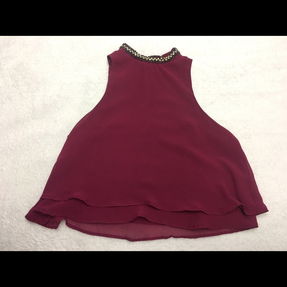Red blouse with necklace accent